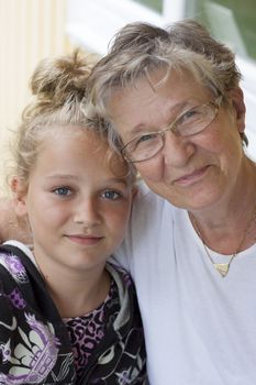 a grandmother and grandchild looking at camera