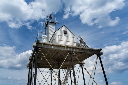 The Gloucester Harbor Beacon Station sits on the end of a breakwater one half mile into the harbor.