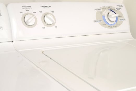 white washing machine or washer and dryer