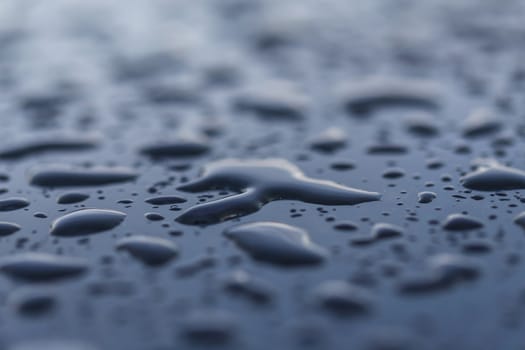 Drops of water on a glossy surface