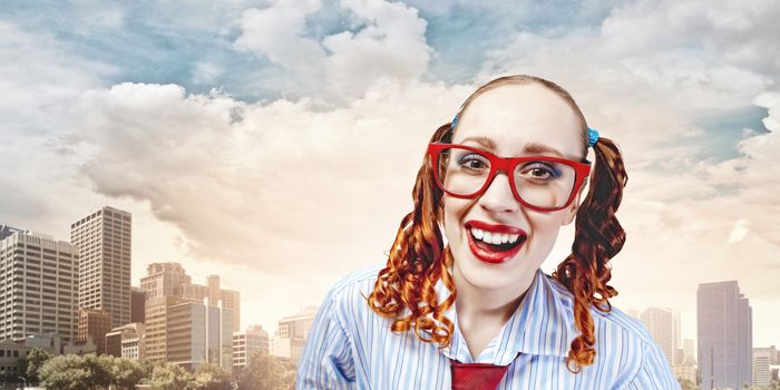 Funny looking red-hair woman with glasses staring at camera