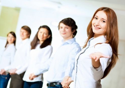 Image of five students in casual wear standing in row