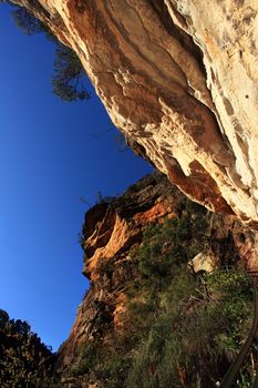 The historic National Pass trail takes visitors along some spectacular scenery featuring cliffs of red, pink and white in the World Heritage lsted Blue Mountains, Australia.