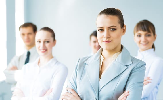 successful businessmen, a portrait of a business woman standing next to colleagues