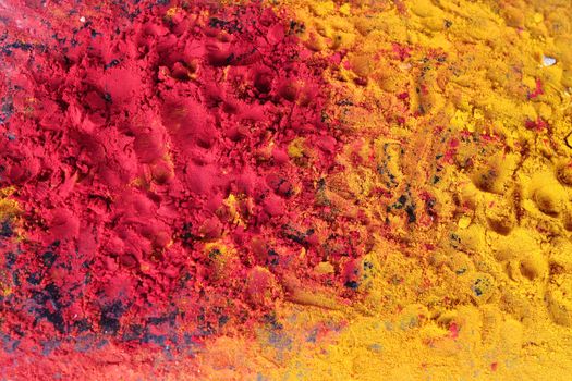 Yellow and red powder religious puja in a temple in India