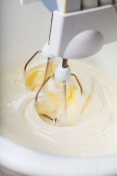 Closeup view of batter wipped with mixer