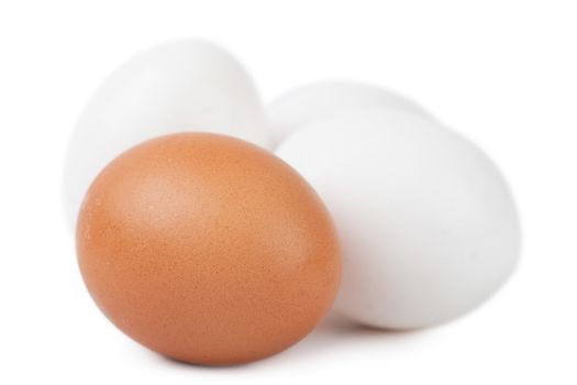 Macro view of brown and white eggs isolated on the white