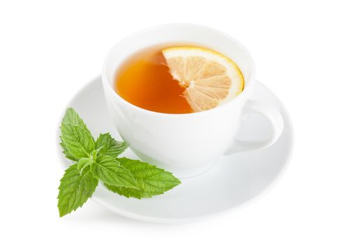 Tea with piece of lemon and mint on a plate over white background