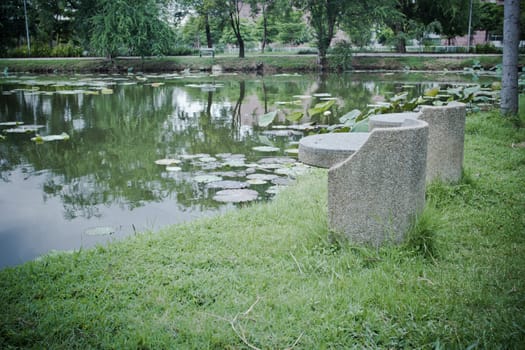 stone bench at Vachirabenjatas Park (Rot Fai Park) in Thailand - nice background