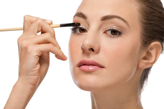 attractive woman in beauty salon make up brown eyeshadow professional 