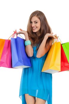 attractive young woman with colorful shopping bags isolated on white background