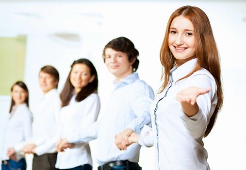 Image of five students in casual wear standing in row