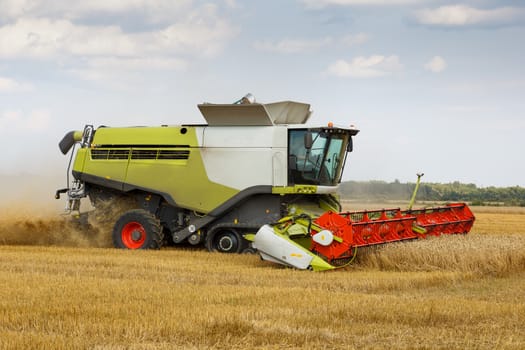 harvesting combine in the wheat field