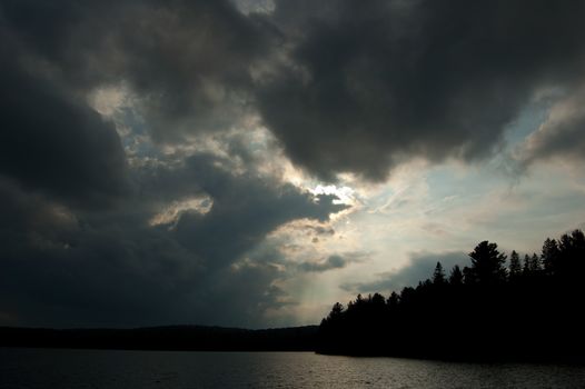 Dramatic summer cloud with sunbeam in Algonquin Park