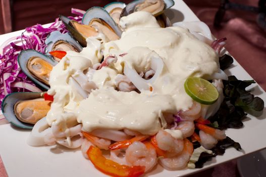 seafood with white souce, shrimps mussels and squids