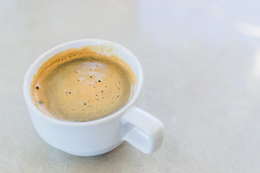 Hot Coffee in white cup and drink it in the morning with breakfast.