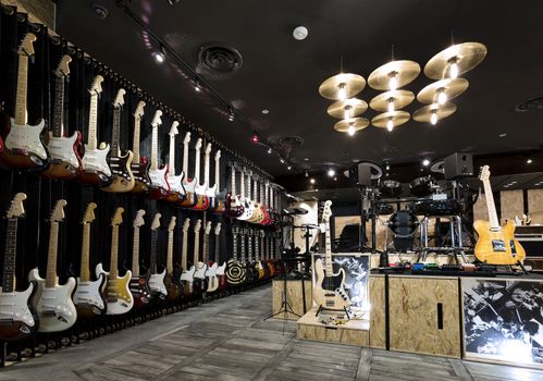 Horizontial shot of inside a musical instrument store.