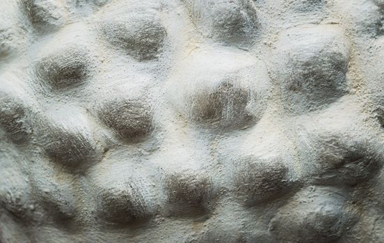 Embossed stone seamless background.