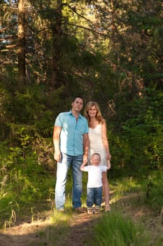 Young family recreate in park.