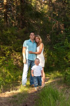 Young family recreate in park.