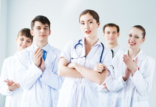 team of experienced highly qualified doctors, fold one's arms