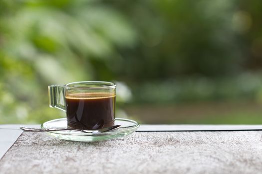 Black coffee in a glass on the table