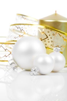 Christmas balls with golden candle, on a white background