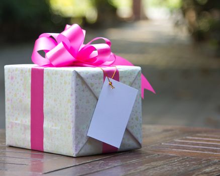 Images of pink gift boxes located on the table