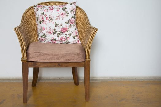 Wicker chairs are placed in the living room.
