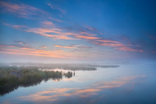 sky reflected in lake at misty morning, Onlanden, Groningen, Netherlands