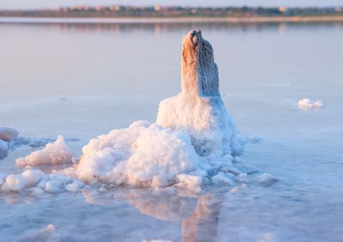 All objects in this lake covered with salt. Water contains minerals and so is multicolored.