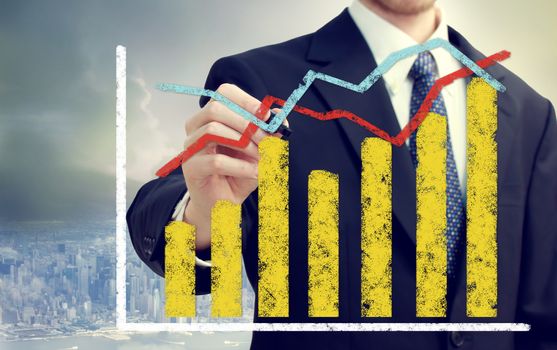 Businessman with bar and line graphs representing overall growth