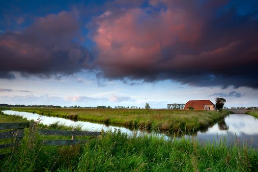 dramatic sunrise over Dutch farmland, Groningen, Netherlands