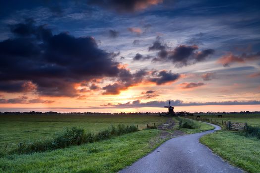 dramatic summer sunrise over Dutch windmill, Holland