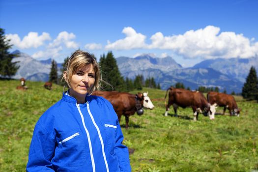 beautiful woman farmer in alpine mountain, France