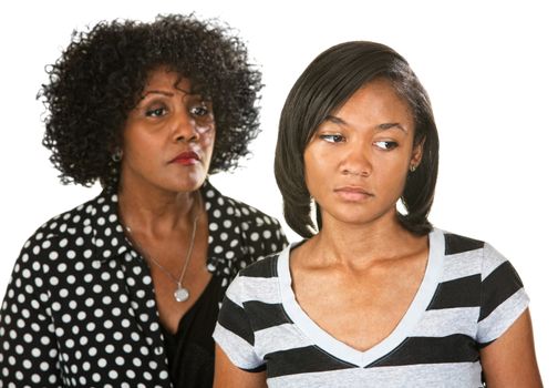 Sad mother with teenage daughter on isolated background