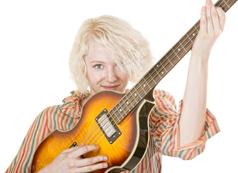 Grinning young lady electric guitarist on isolated background