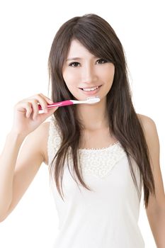 Attractive asian woman brushing teeth on the white background.