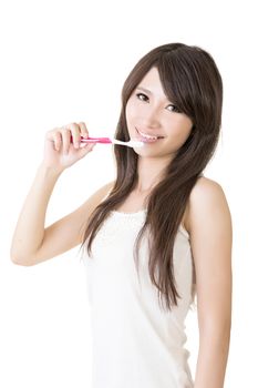 Attractive asian woman brushing teeth on the white background.