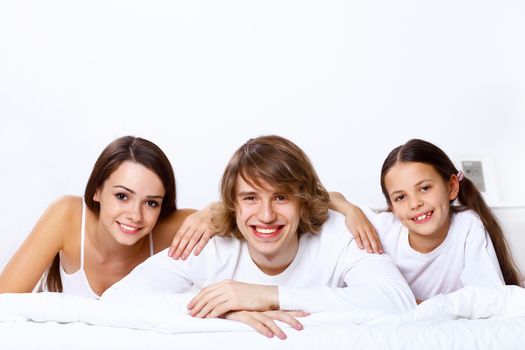 Young family with little daughter at home together