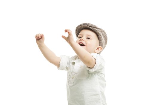 Little boy in a fashionable cloth cap laughing and stretching out his arms above his head, upper body isolated on white
