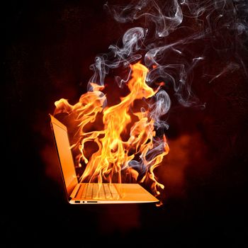 Illustration of burning laptop in fire flames