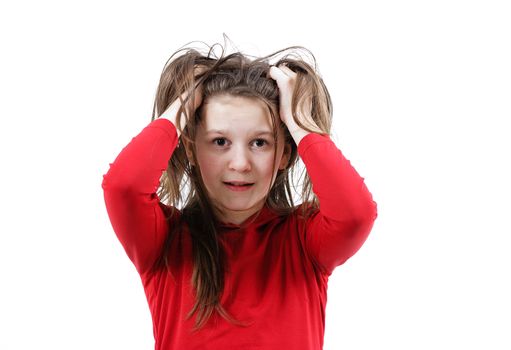 Disheveled frightened girl child on a white background