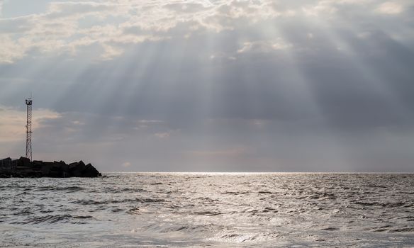 the sun's rays penetrate through clouds over the Baltic Sea, Klaipeda, Lithuania