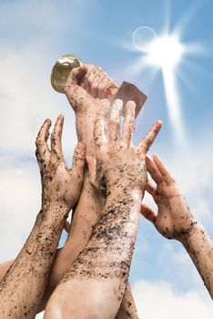 hand holding a cup of the winner, the other hand are drawn to it