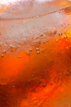 Closeup take of a glass filled with coke