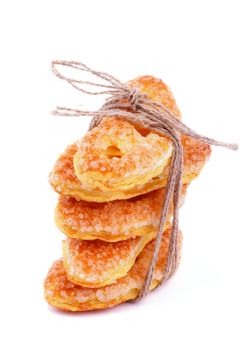 Pile of Puff Pastry Cookie Sprinkled with Sugar Crystals isolated on white background