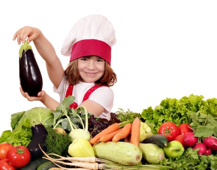 little girl cook holding aubergine