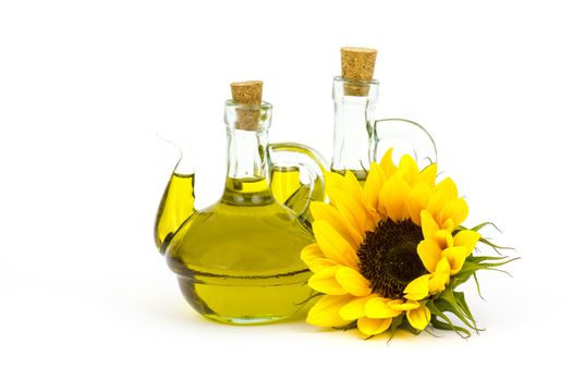 sunflower oil and sunflowers isolated on white background