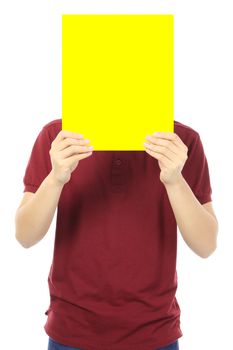 A young man holding a blank yellow signboard